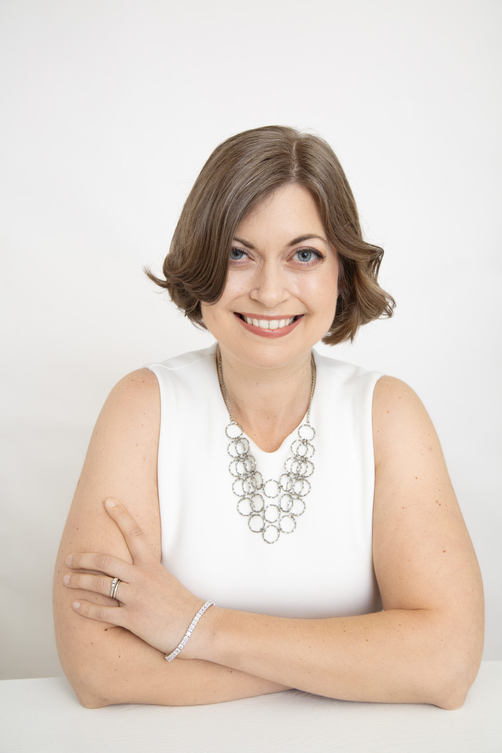 Professional headshot of a woman from a brand experience session with Redhead Creative Media in Chapel Hill, NC.