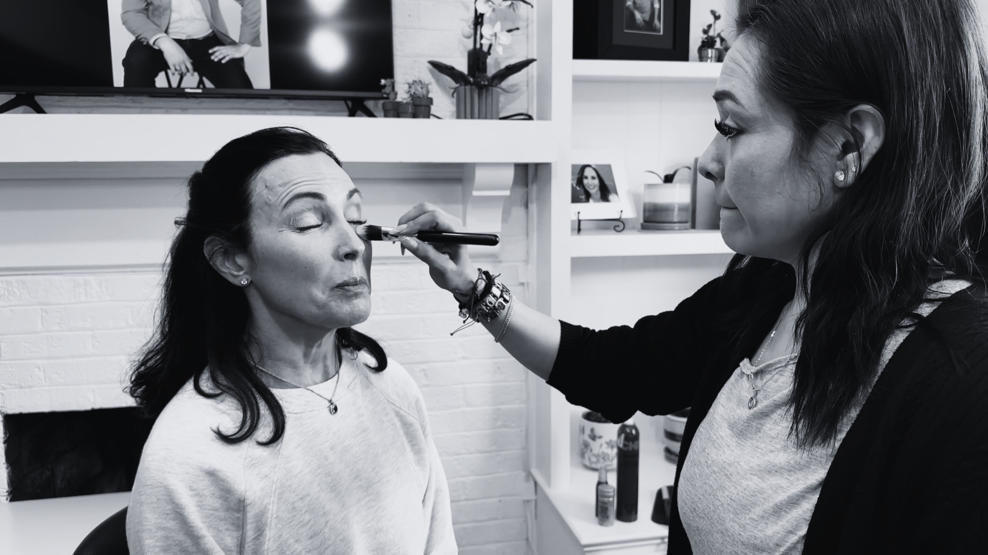 A client relaxes during hair and makeup at a Brand Authority Experience with Redhead Creative Media in Chapel Hill, NC.